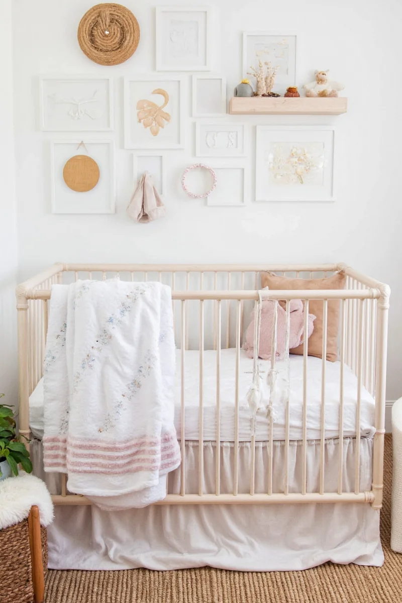 Happy parents sitting in a cozy nursery watching their toddler explore