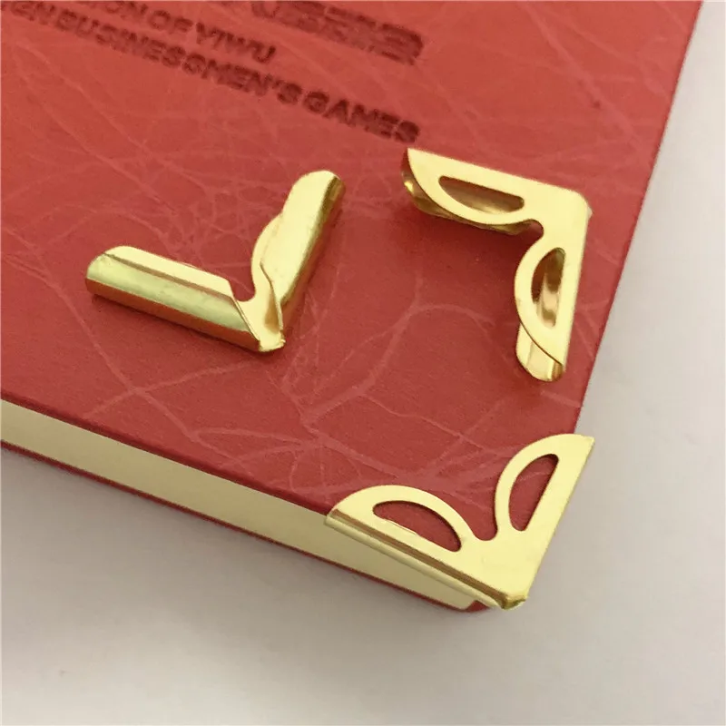 

China manufactures decorative metal corner protection for notebook abulms, Brass plated, silver