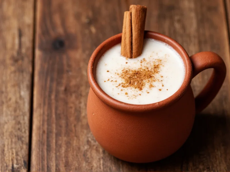 Horchata served in clay mug with cinnamon garnish on rustic table