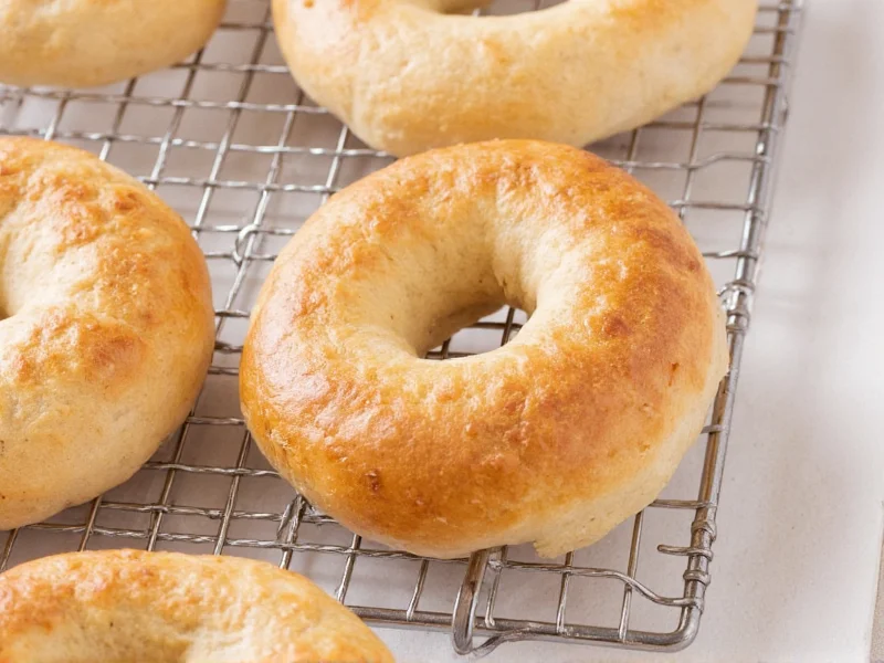 Homemade bagels cooling on wire rack