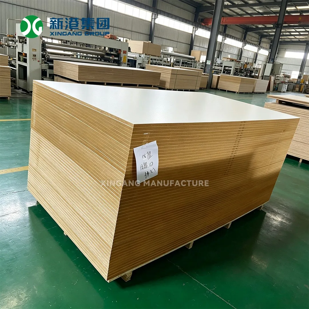 Stacks of white-faced MDF panels in a manufacturing facility