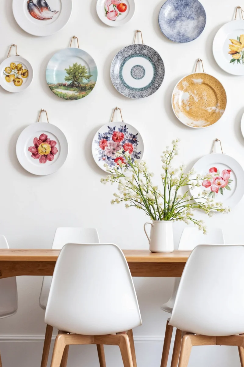Gallery wall incorporating decorative plate rack