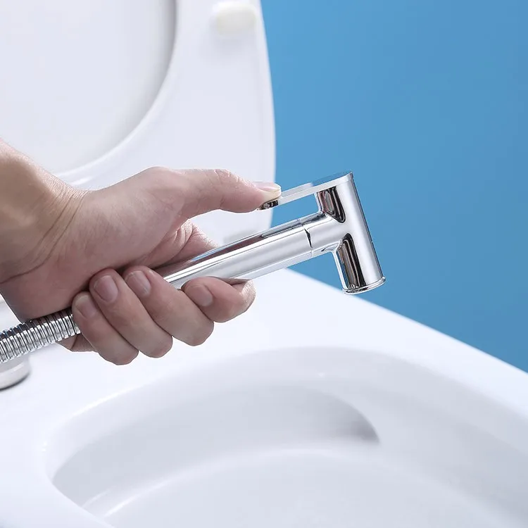 bidet-faucet-sprayer-068-round-cylindrical-body-in-hand-toilet-use