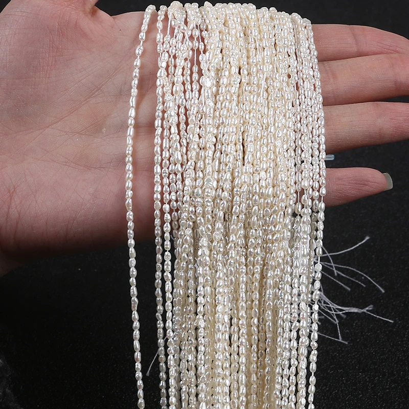 

Wholesale white tiny  rice shape loose freshwater pearl beads strings