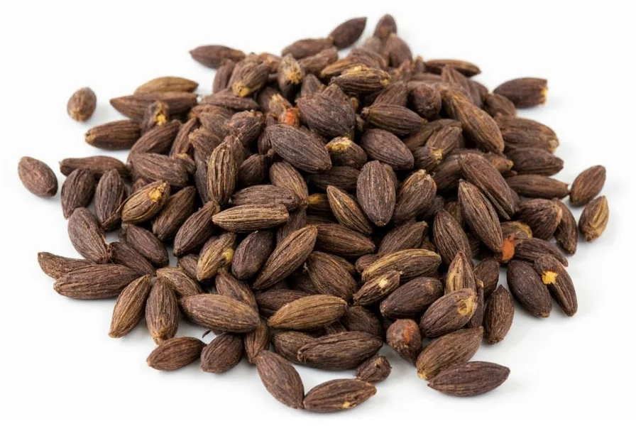 Close-up photograph of black cardamom pods showing their rough, dark brown texture and triangular shape compared to smooth green cardamom pods