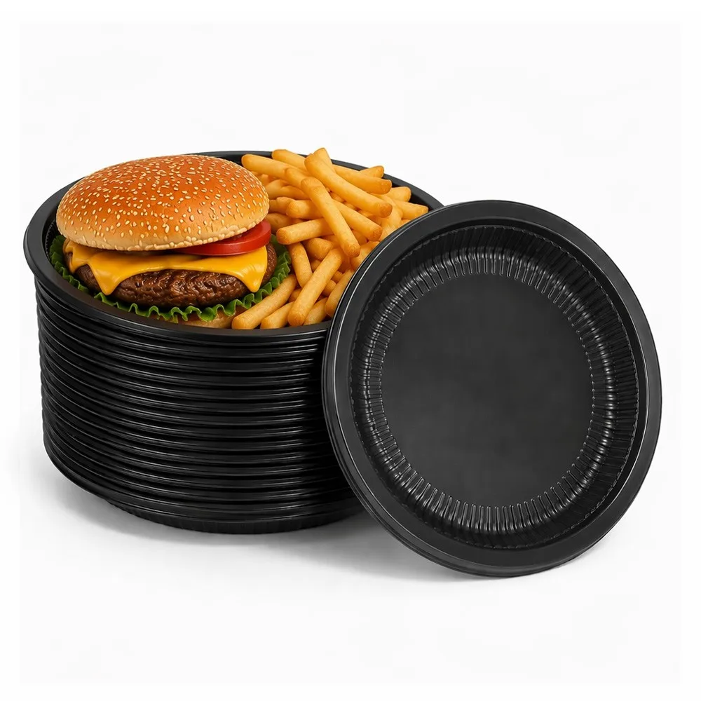 Nestable stacking design of black PP disposable plates — a full stack next to a plated cheeseburger and fries showing the compact profile