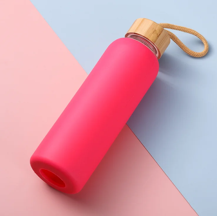 

Hot Selling Portable Nice Quality Borosilicated Glass Water Bottle with Bamboo Lid and Protective Silicone Sleeve, Transparent glass