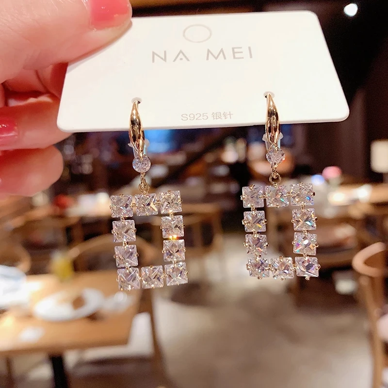 

Kaimei Luxury Fashion Crystal Statement Earrings Female Jewelry 2021 New Classic Cubic Zirconia Gold Pendant Earrings for Women, Many colors fyi