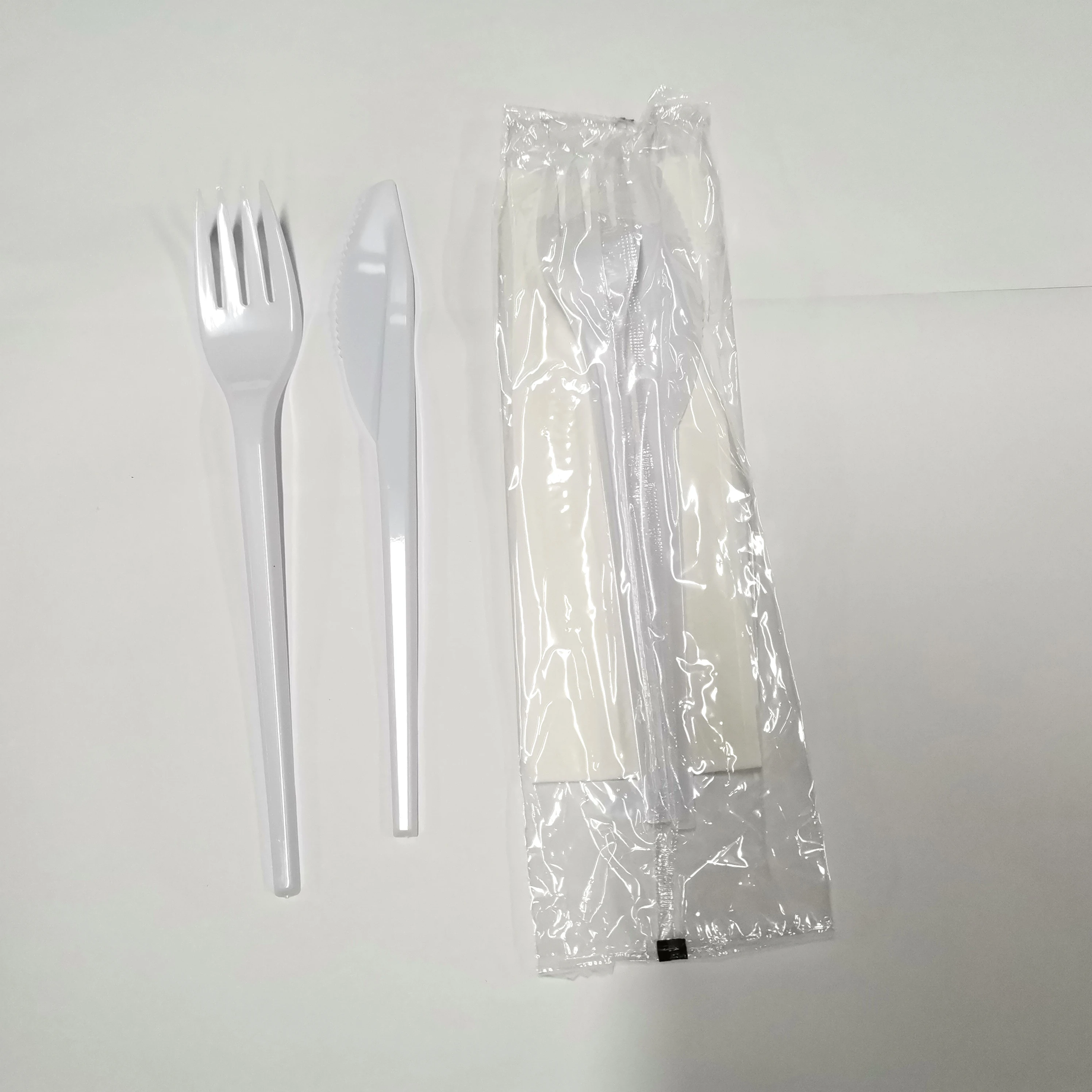 

PS white disposable trays in party packs wrapped plastic cutlery