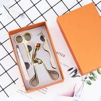 

Private label rose glod color makeup tools kit curler tweezer and scissor 4 in 1 packaging box set wholesale eyelash tools set