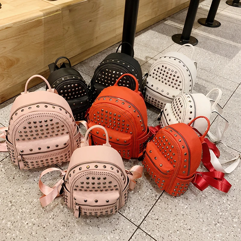 

2022 wholesale fashion two size big and small student pink rivet women pu leather school backpack, 4 colors