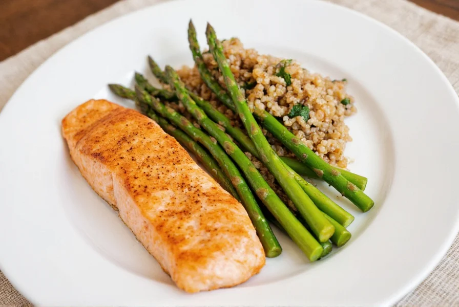 Plated lemon pepper salmon with roasted asparagus and quinoa