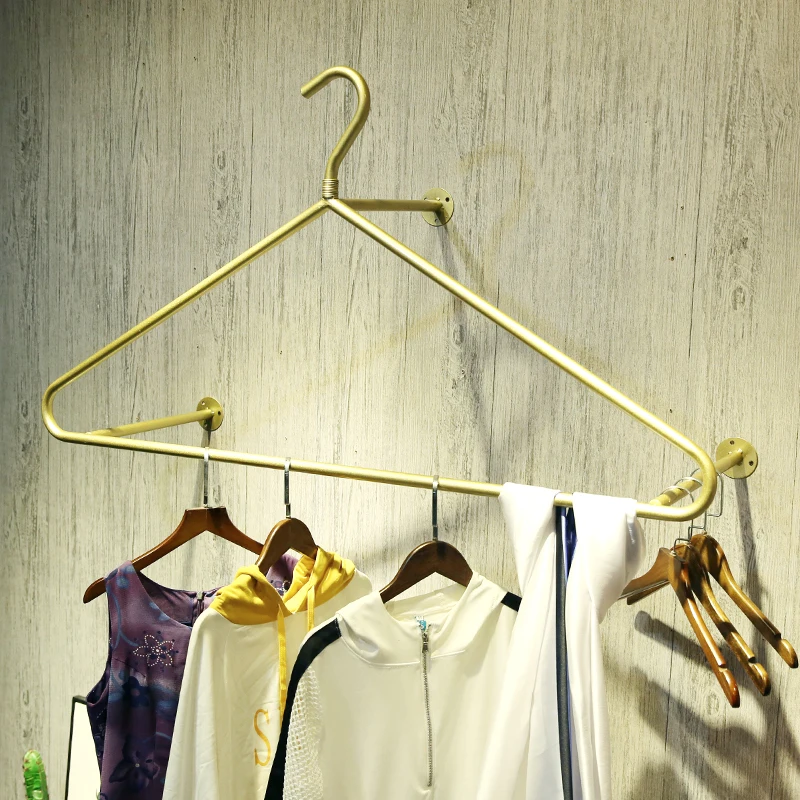 

clothing store shop metal display rack wall mounted golden hanger garment shelf wall hanging hanger direct factory