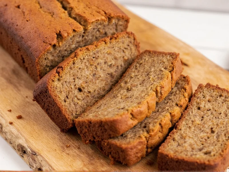 Sliced homemade banana bread on rustic wooden board