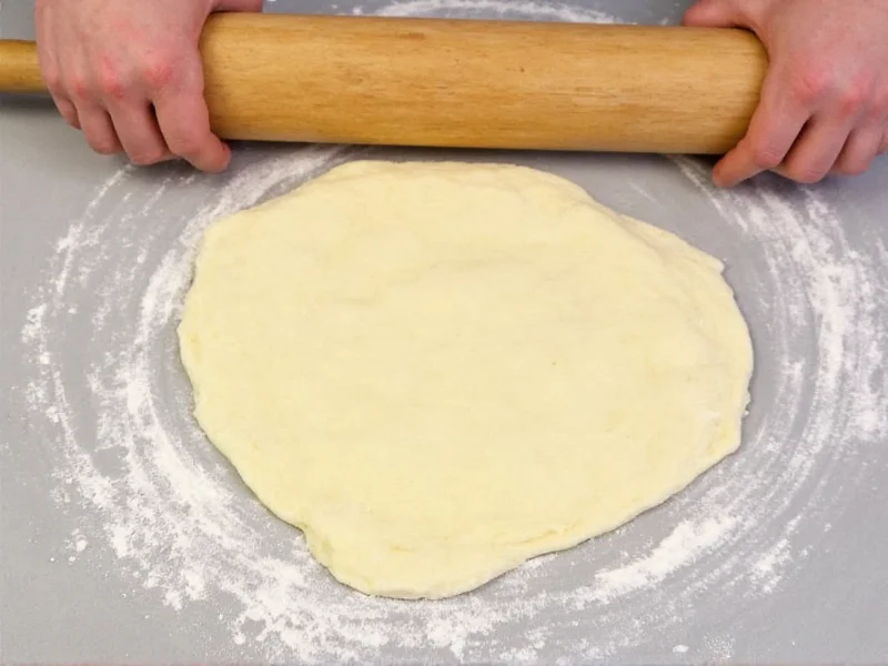 Rolling smooth donut dough on floured surface for cutting