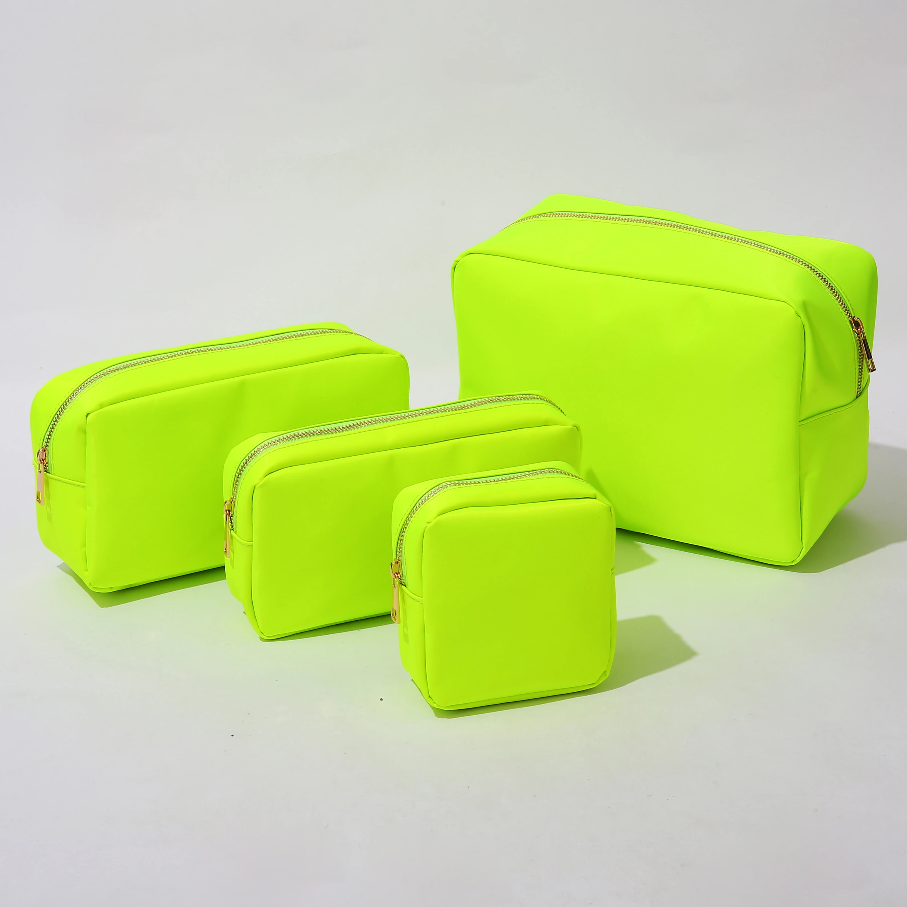 

Stock New Neon Green Large Capacity Nylon Travel Wash Bag Set Personalized DIY Patches Logo Cosmetic Pouch