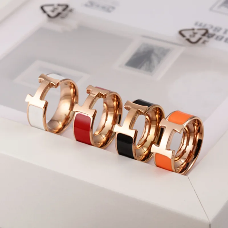 

Fashion accessories wholesale men and women ring black and white red orange drop oil enamel H letter titanium steel ring
