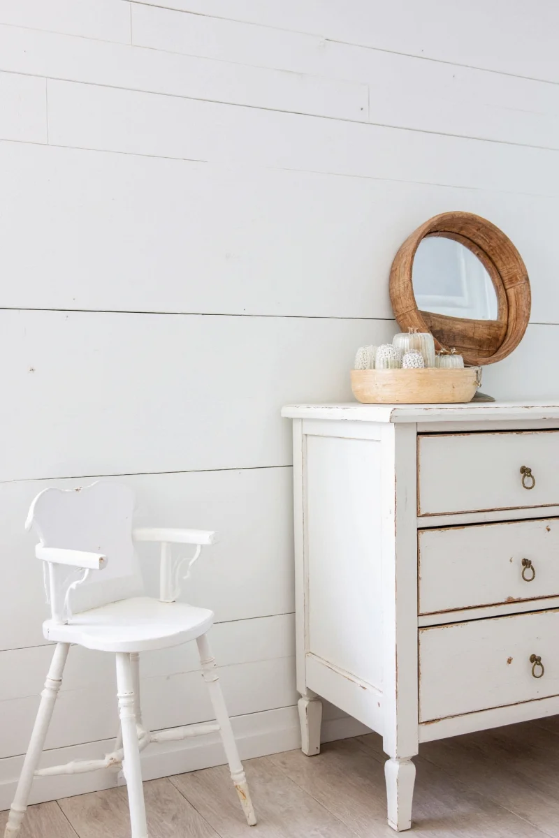 Side-by-side photos showing knotty pine in a kitchen and bathroom