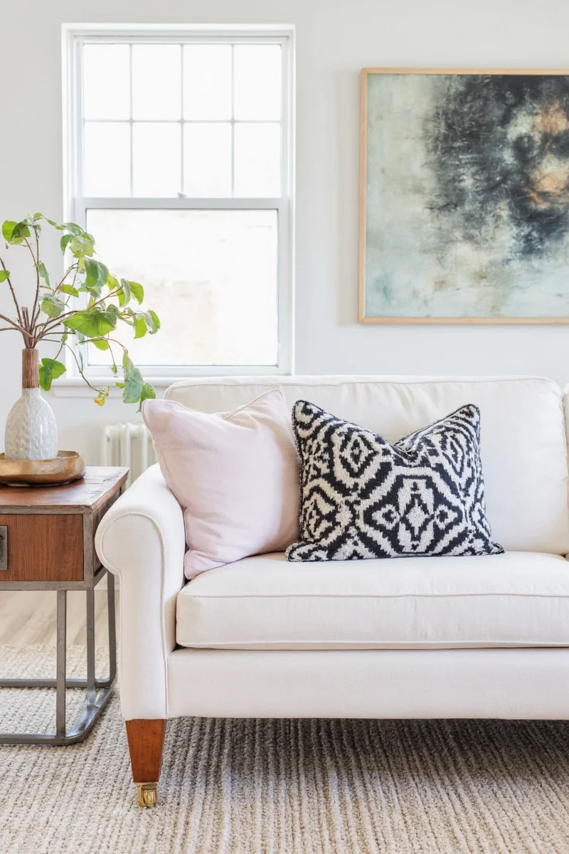 Cozy knit throw blanket on a neutral sofa