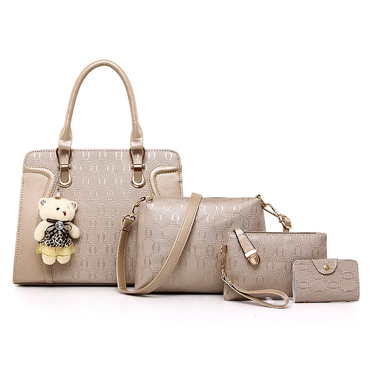 

embossed leather premium ladies  handbag with bear pendant