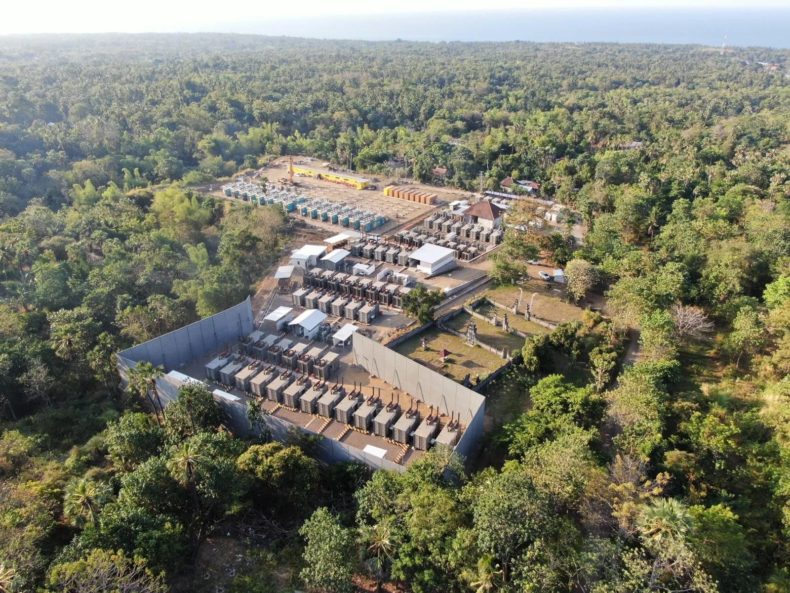 Aerial view of an 8 m high noise barrier enclosing power plant equipment in Indonesia
