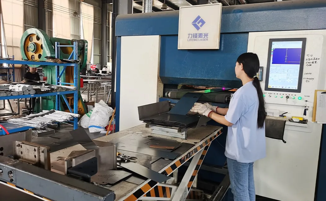 how steel lockers are made — fiber laser cutting machine cutting locker panels in a bright factory