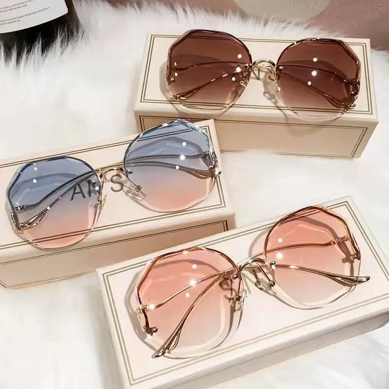 

European-American new trend sun glasses gafas de sol rimless gradient top sale sunglasses women