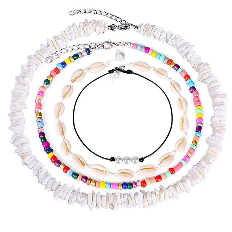 

Ruigang Handmade Hawaiian Fresh Water Pearl Rainbow Seed Beads Choker Sets Natural White Puka Chip Shell Necklace for women men, As picture