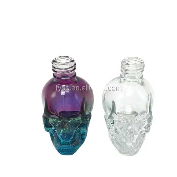 

Hot sale fancy empty glass skull oil bottle with child proof dropper