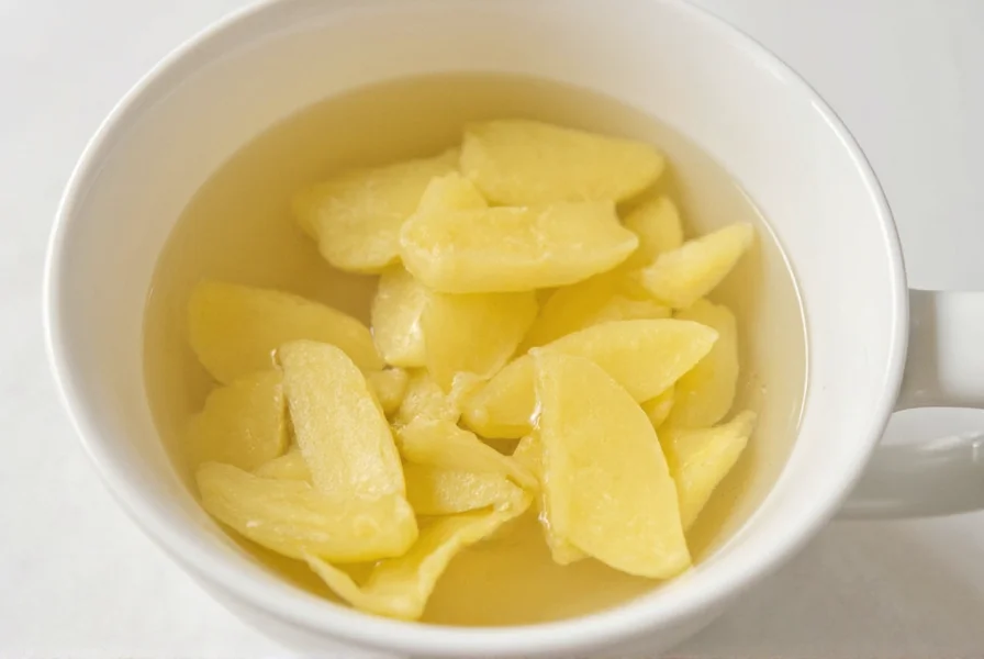 Steeping ginger slices in hot water for homemade ginger tea