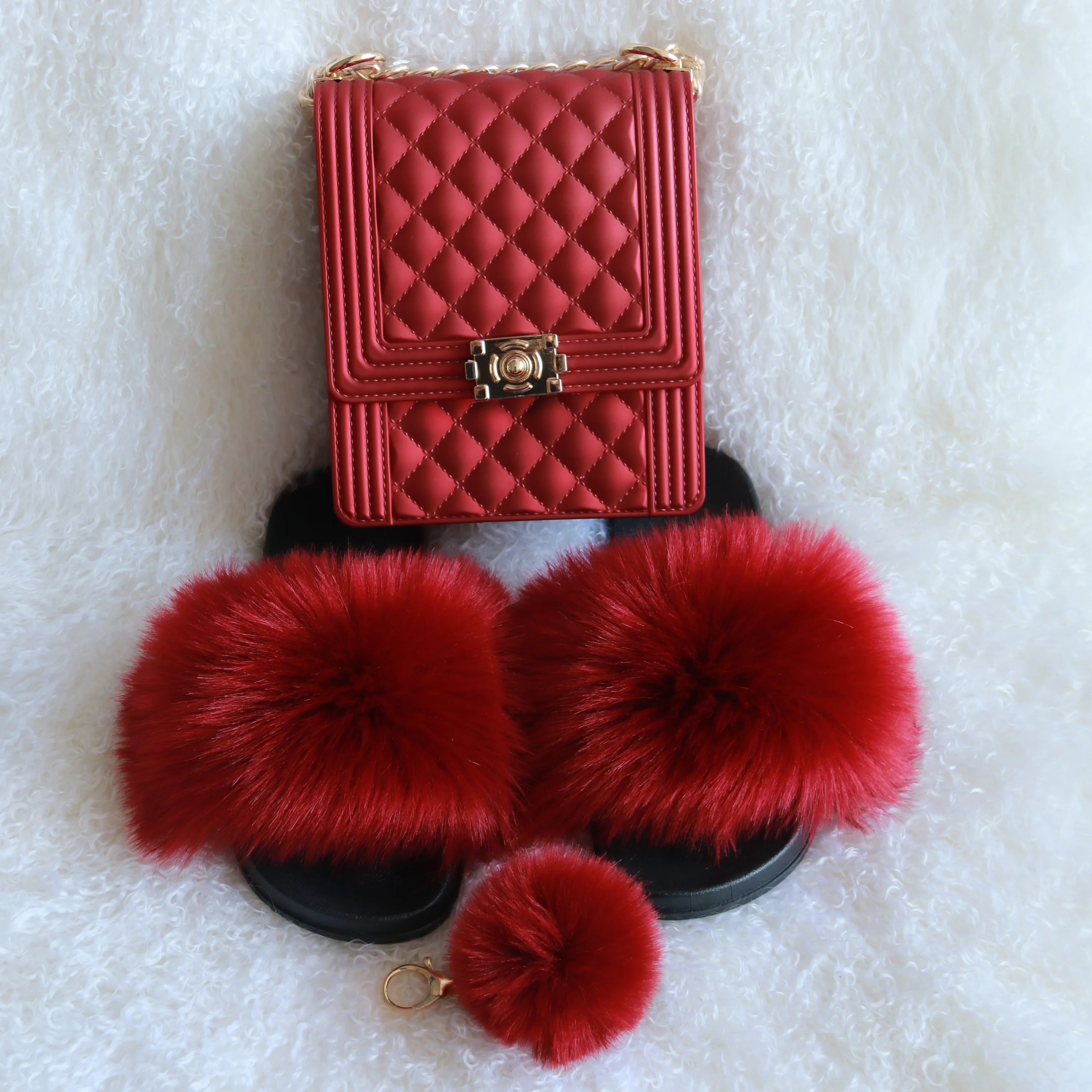 

red fur slides and purse