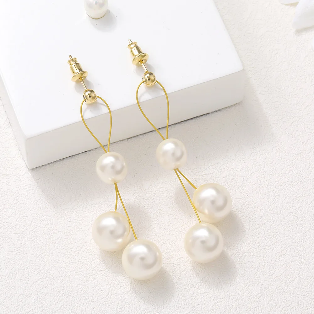 

Trendy Gold Plated Thread Pearl Long Tassel Pendant Earrings, Picture shows