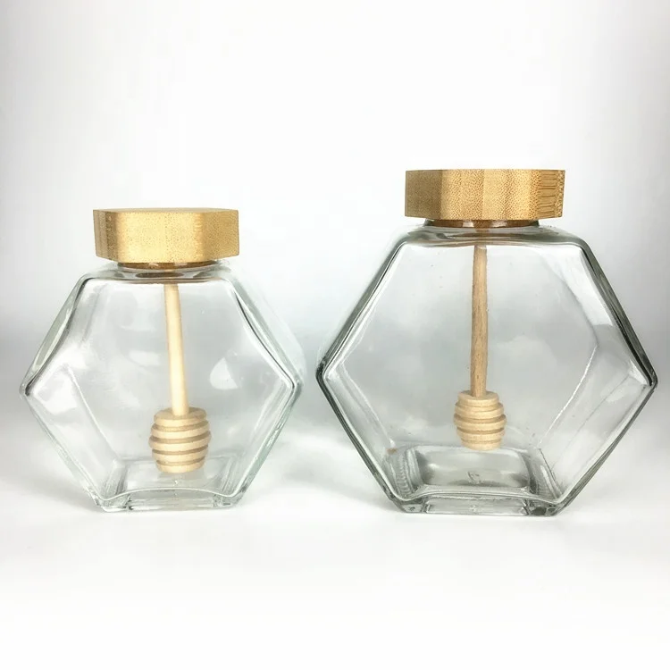 

Clear unique hexagon glass honey jar with wooden lids and dipper