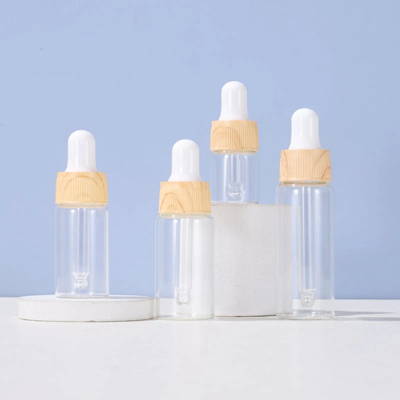

High quality round essential oil bottle serum dropper glass bottle with wooden cap