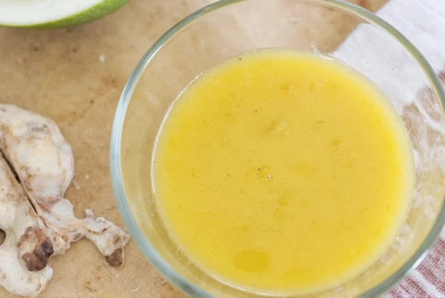 Step-by-step preparation of fresh ginger dressing in glass bowl with ingredients arranged around it