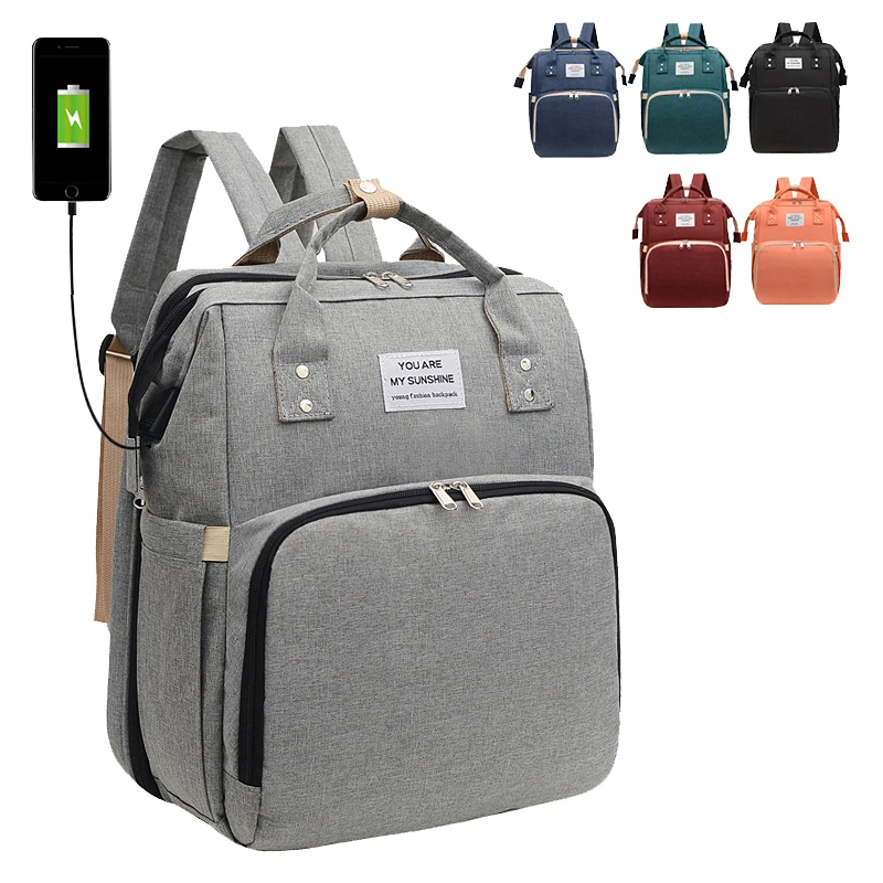 

Mother Baby Diaper Bag OEM Customize Multi Function Gray Backpack Waterproof USB Charging with Folding Crib Changing Station Pad