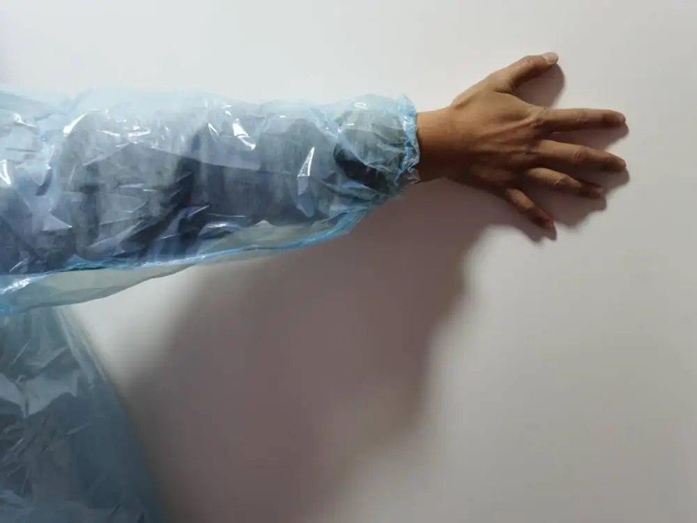
large amount stock PE Raincoat with elastic Cuff and hood 