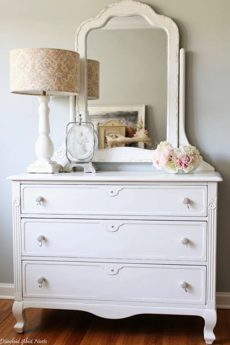 Modern nursery with antique oak dresser and neutral tones