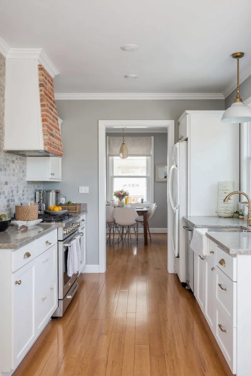 Modern kitchen with grey walls and white cabinets