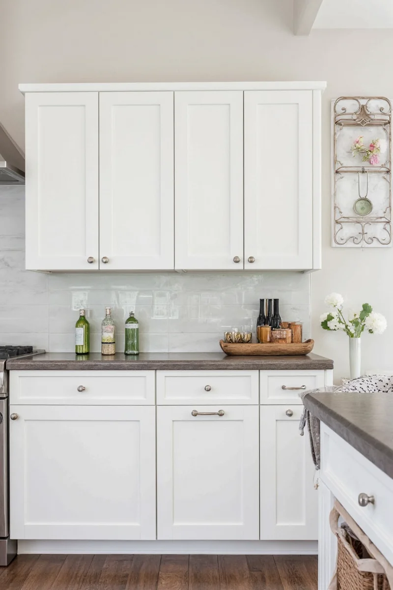 Family-friendly white kitchen with kids' art on the fridge