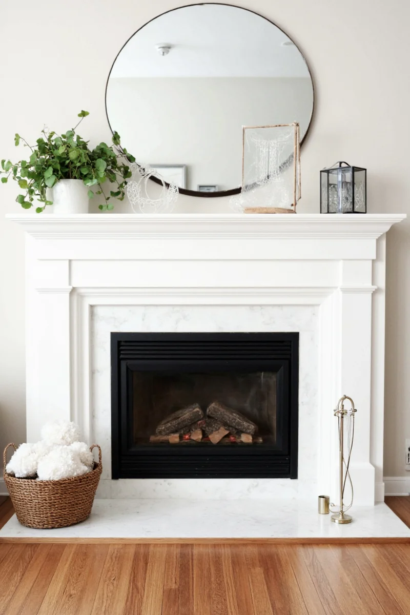 Family-friendly painted mantelpiece styled with kid-safe decorations