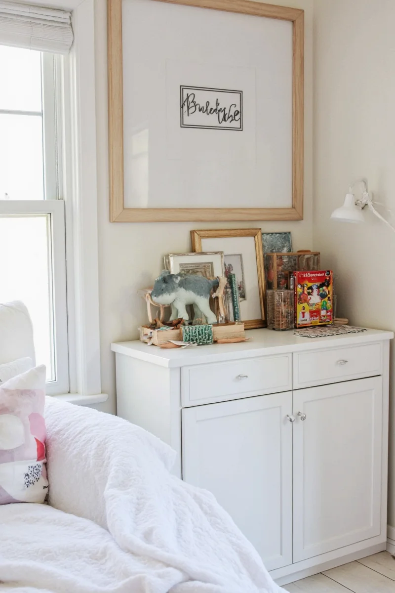Room after rearrangement with organized zones and playful decor