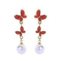 

Ins Style Gold Plated Hypoallergenic Siam Crystal Rhinestone Double Butterfly Insect Imitation Pearl Diamond Dangle Earrings