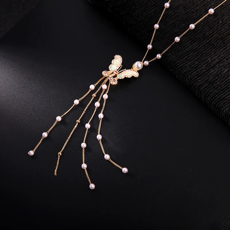 

Enamel lovely butterfly pearl tassel pendant necklace ladies crystal long sweater chain necklace (KNK5145), Same as the picture