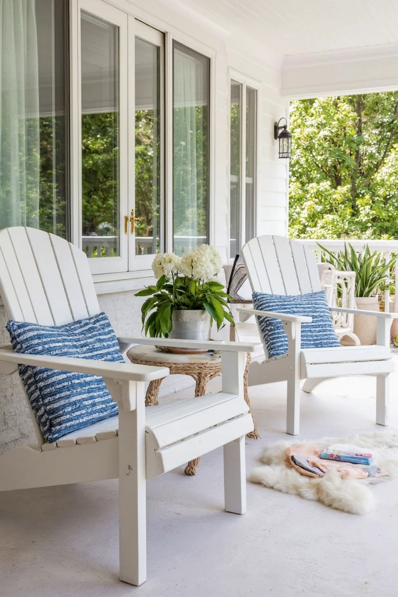 Kids playing near Adirondack chairs on front porch