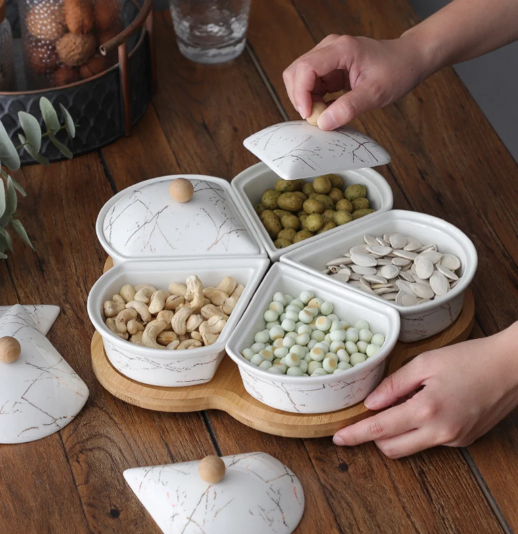 

Factory New flower shaped ceramic dry fruit plate ins wind snacks melon seeds nuts cool fructose fruit creative plate set