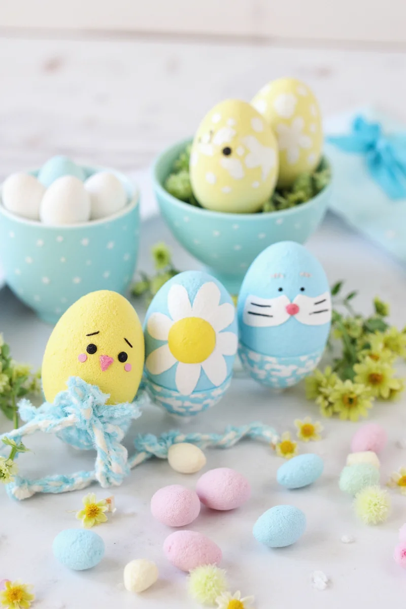 Easter-themed dining table with decorated eggs, flowers, and bunny decorations