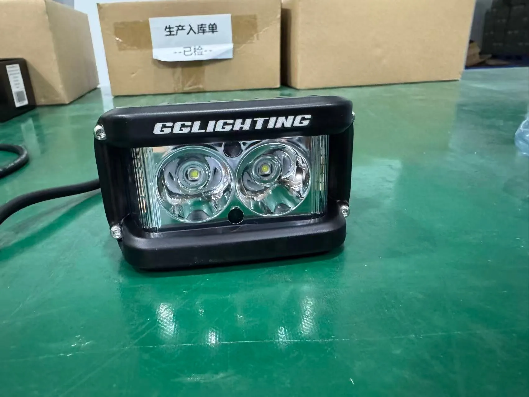 Custom motorcycle auxiliary light with laser-engraved GGLIGHTING logo, dual-lens LED pod