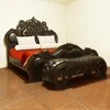 Wooden carved bed design with dragon sculpture and sutudded leather upholstered