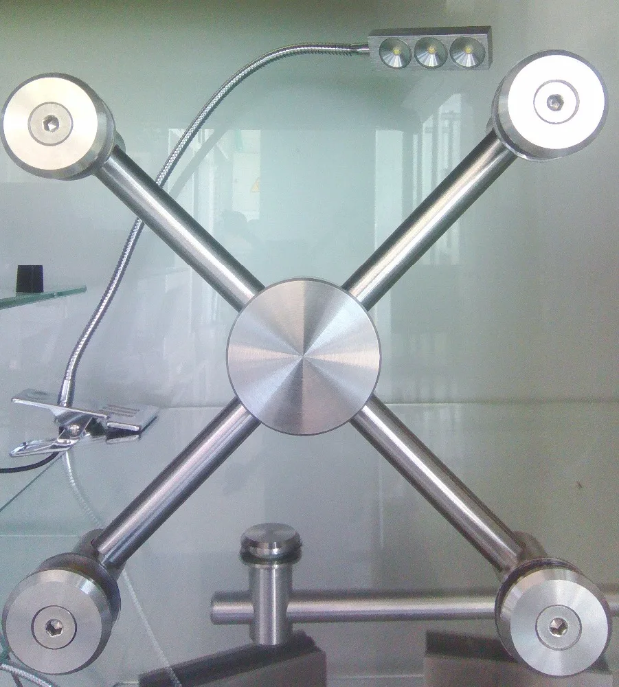 
GLASS CURTAIN WALL FITTINGS, 4 WAY SPIDERS Arana de cuatro puntos para vidrio templado 